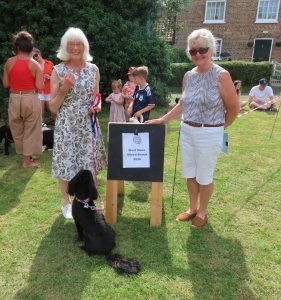 Must Have Mixed Breed winner Teddie with handler Mrs Johnson and judge Celia
