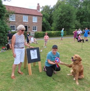 Cutest Puppy and Supreme Champion Rex with handler Caroline and judge Celia